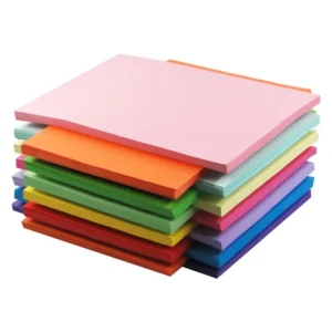 Stacks of vibrant assorted color A4 paper, high-quality 75gsm/80gsm tinted office paper for printing, DIY crafts, and school projects, available for bulk export.